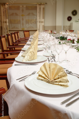 large dinner table set up for a lot of people