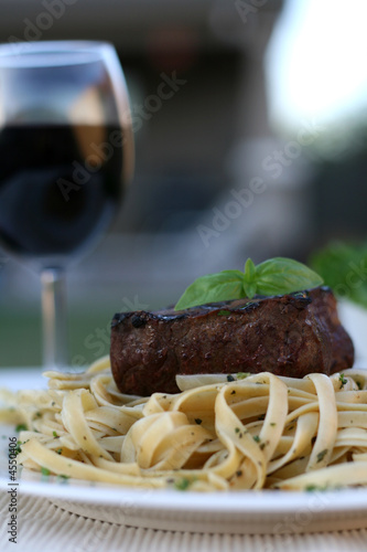 Steak over fettucine with a...