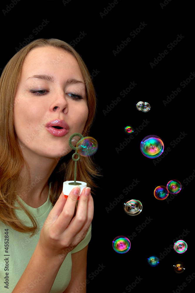 girl playing with lots of soap bubbles girl playing with lots of soap bubbles