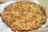 fresh hawaian  flavored pizza from a box