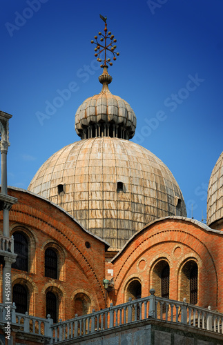 Detail of St. Mark's Basilica against a clear blue sky, in Venic