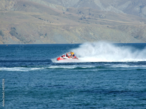 The men goes for a drive on a wave runner on sea waves 2