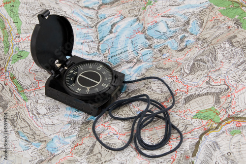 Compass on the map of italian Alps