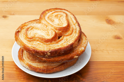 Palmier pastries on white saucer