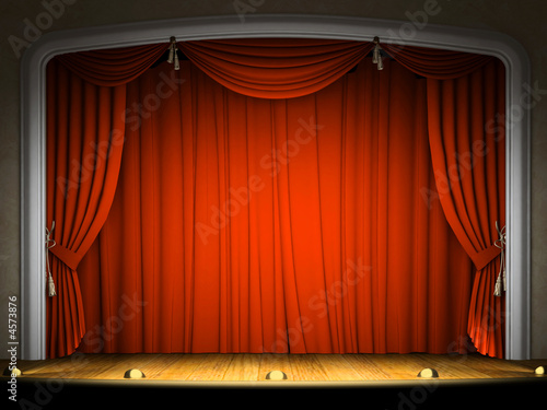 Empty stage with red curtain in expectation of performance photo