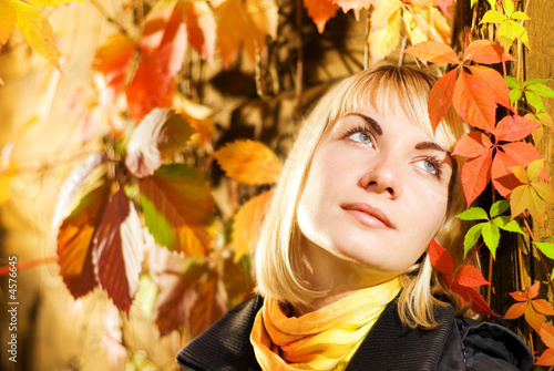 Dreaming girl on autumn background