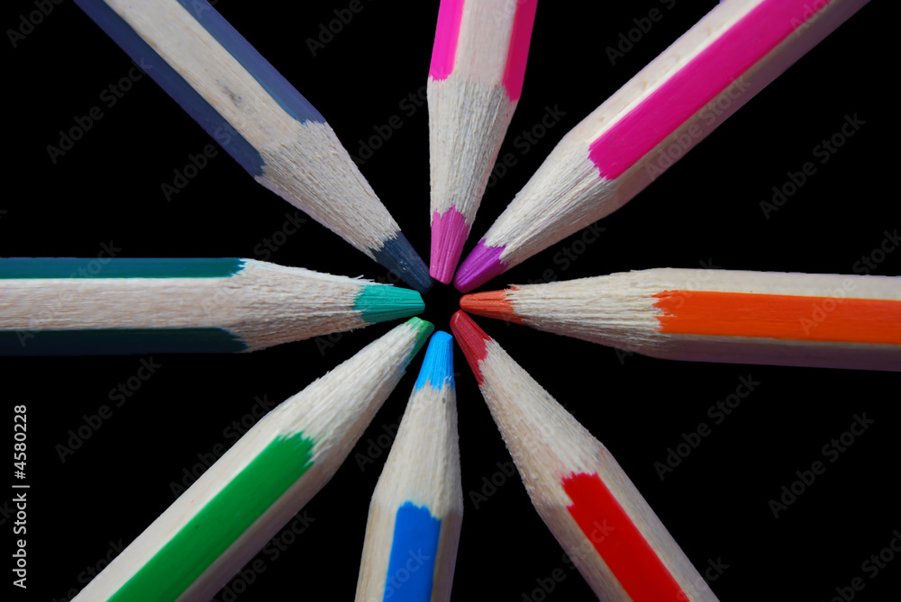 Naklejka premium Colouring pencils against black