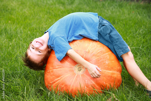 Boy Playing on Pumpkin