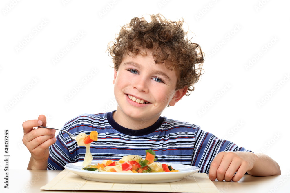 Boy eating pasta