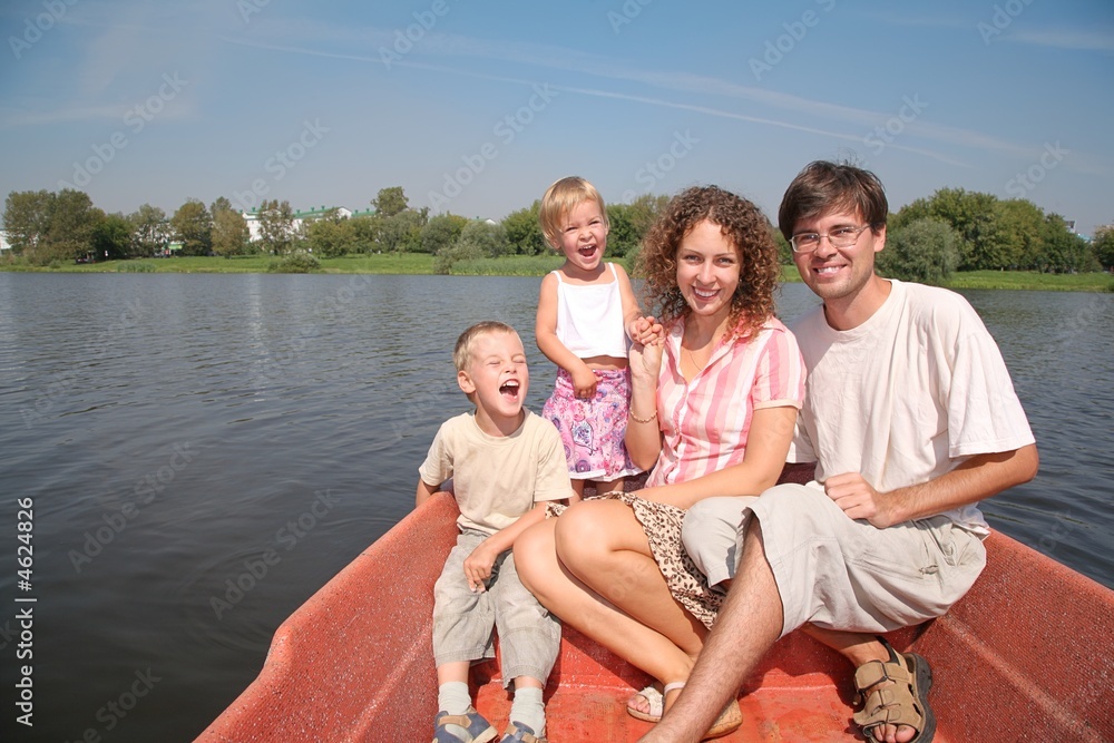 family in the red boat on the river family in the red boat on the river