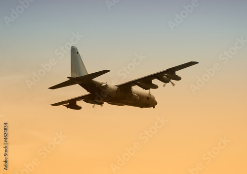 Military transport C-130 at dawn