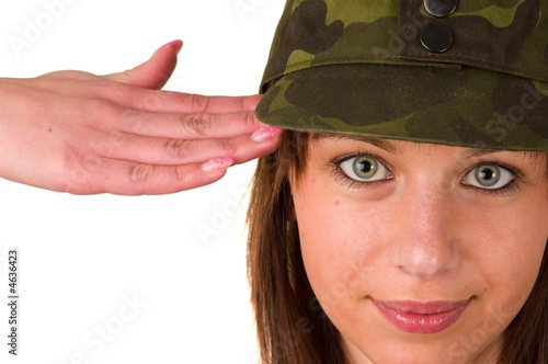 Girl in military cap saluting isolated on white