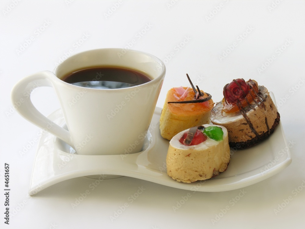 cup of black coffee and small tasty cakes