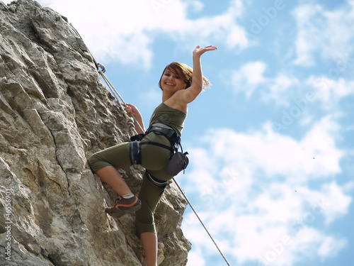 Fotografie Girl climbing and greeting
