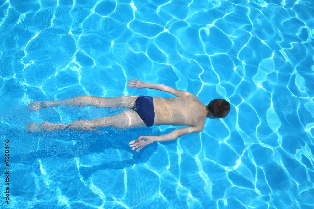 men floating in pool