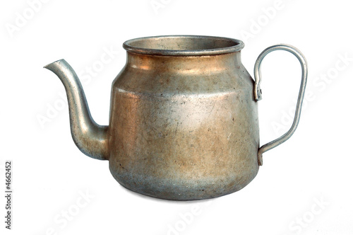 Old metal teapot, isolated on white background