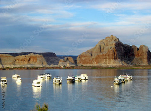 boats parking in front of sandrock formations photo