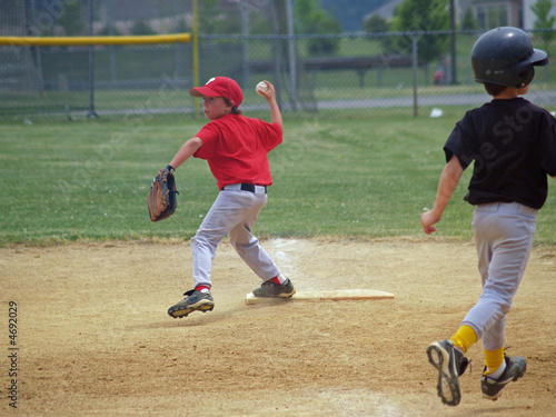 Photography young baseball player at first base