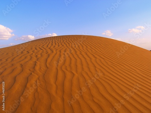 The dune waves in Indian desert with blue sky