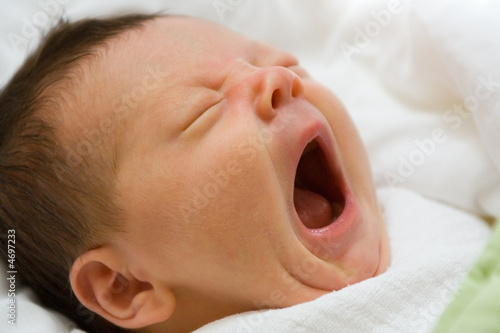 Newborn infant yawning