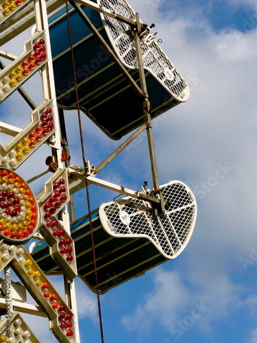 Carnival ride with brightly colored neon lights photo