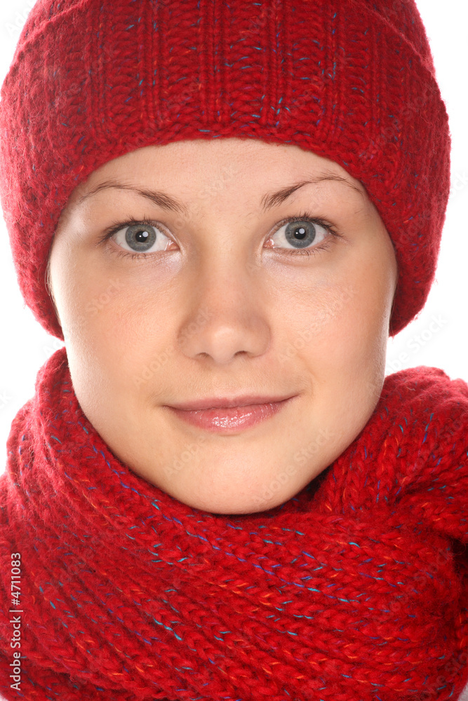 Beautiful girl with blue eyes in red knitted cap and scarf Beautiful girl with blue eyes in red knitted cap and scarf