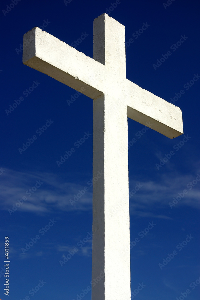 white cross against the blue sky