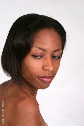 Pretty african american woman looking over shoulder © Allen Penton