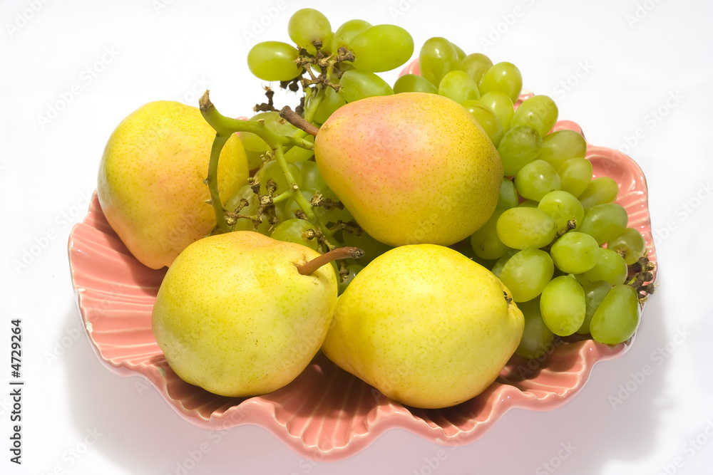 pears and grapes in pink vase with white background pears and grapes in pink vase with white background