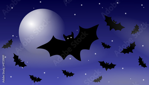 Halloween bats flying under the moon