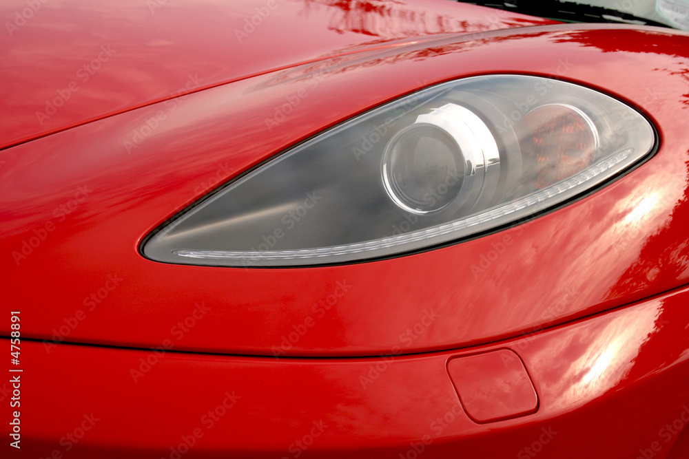 Headlamp on a bright red super car