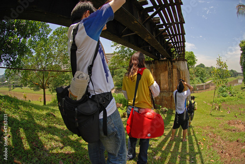 People taking photo along the railway bridge 