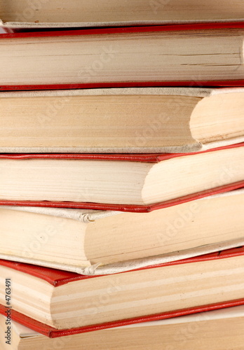 Stack of red and white old books