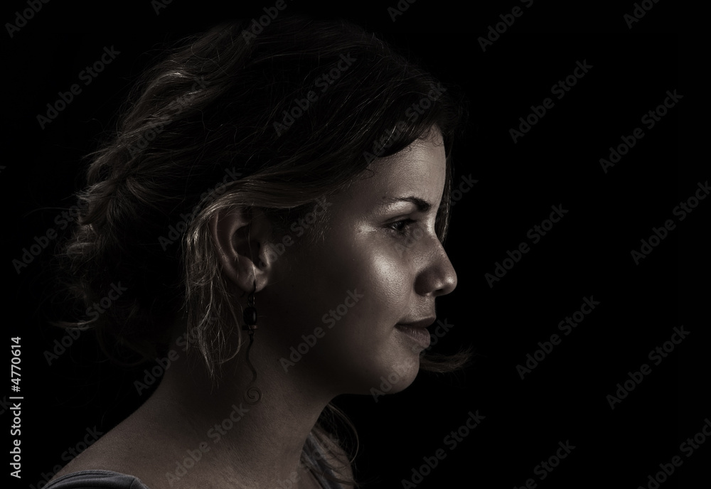Dreamy portrait - Woman profile on dark background