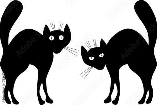 Two black cats. A vector illustration. Contour.