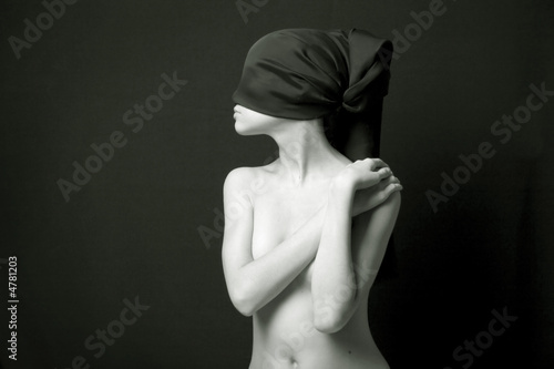 Nude woman with black bandage