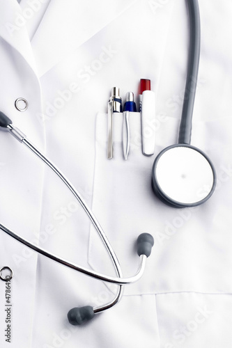 Medical tools on doctor's lab coat 