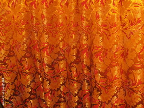 Ancient gold and red ornamental curtain fabric