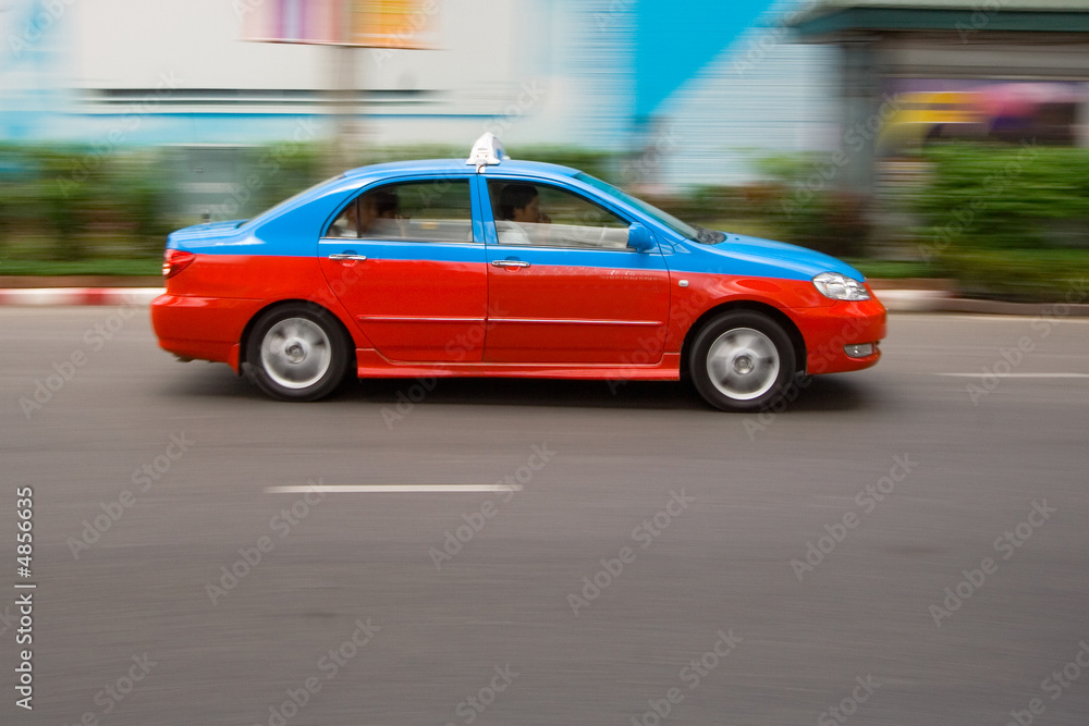 Fast taxi in city traffic