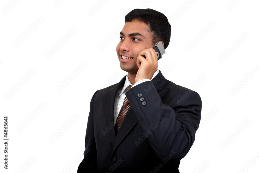 Indian Business man using cellphone (2) with clipping path Indian Business man using cellphone (2) with clipping path