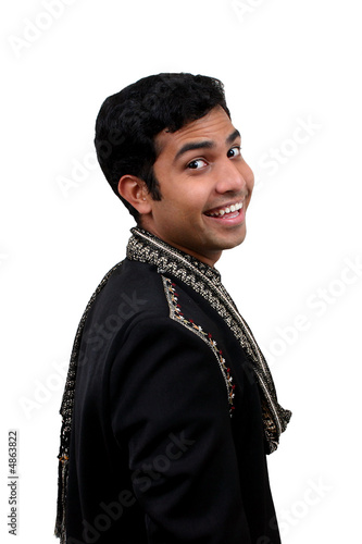 Indian in traditional clothes looking behind