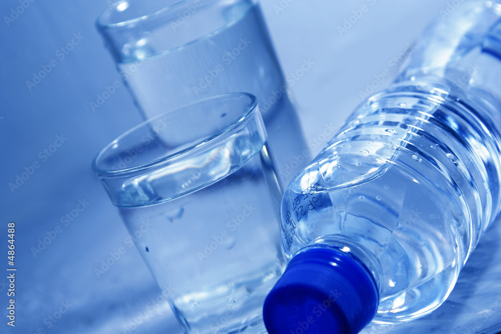 Bottle and glasses of mineral water Bottle and glasses of mineral water