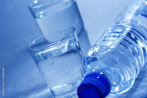 Bottle and glasses of mineral water 