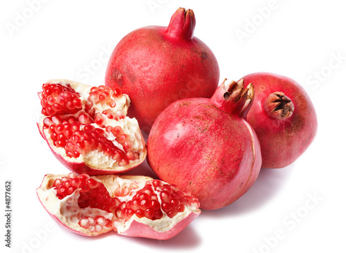 Colorful pomegranates isolated on white