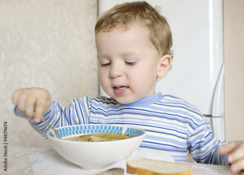 little boy eating soup little boy eating soup