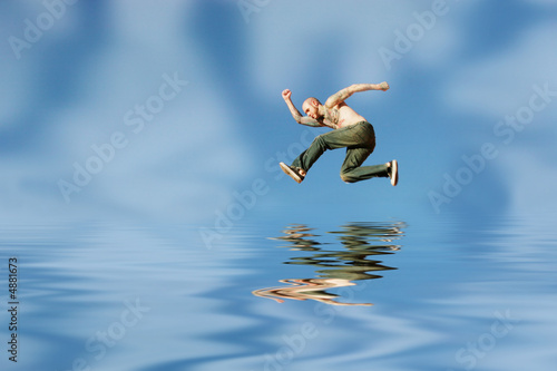 Man jumping into water