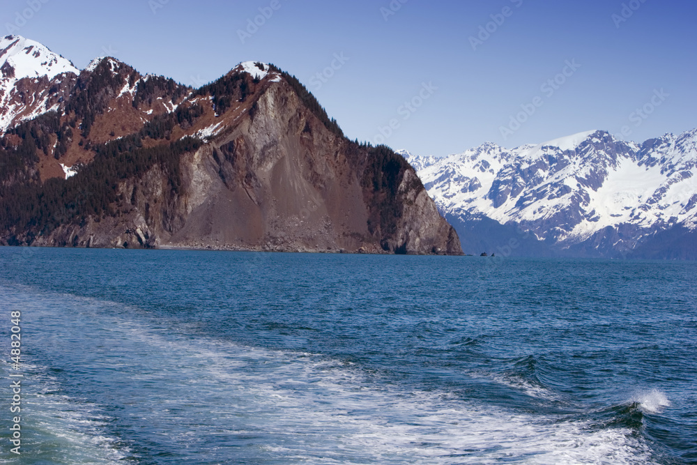 Snowy mountains by the ocean