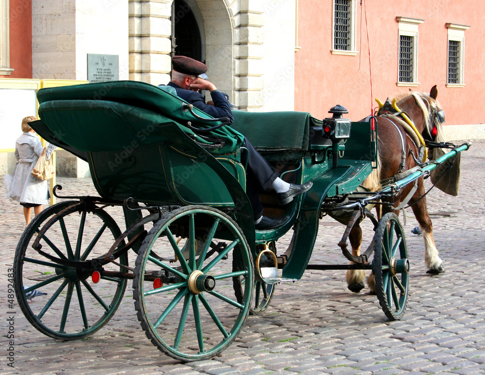 Carriage with a sleeping coachman in Warsaw Old Town