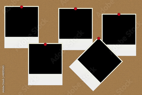Blank polaroid photos on a board