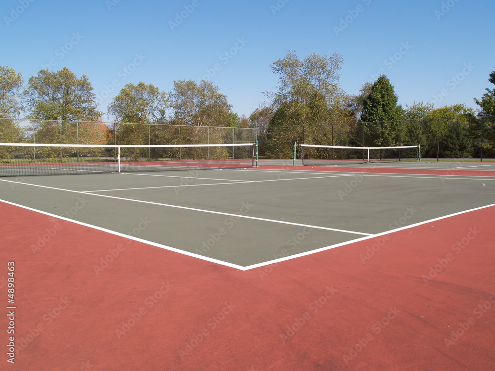 tennis court on clear autumn day